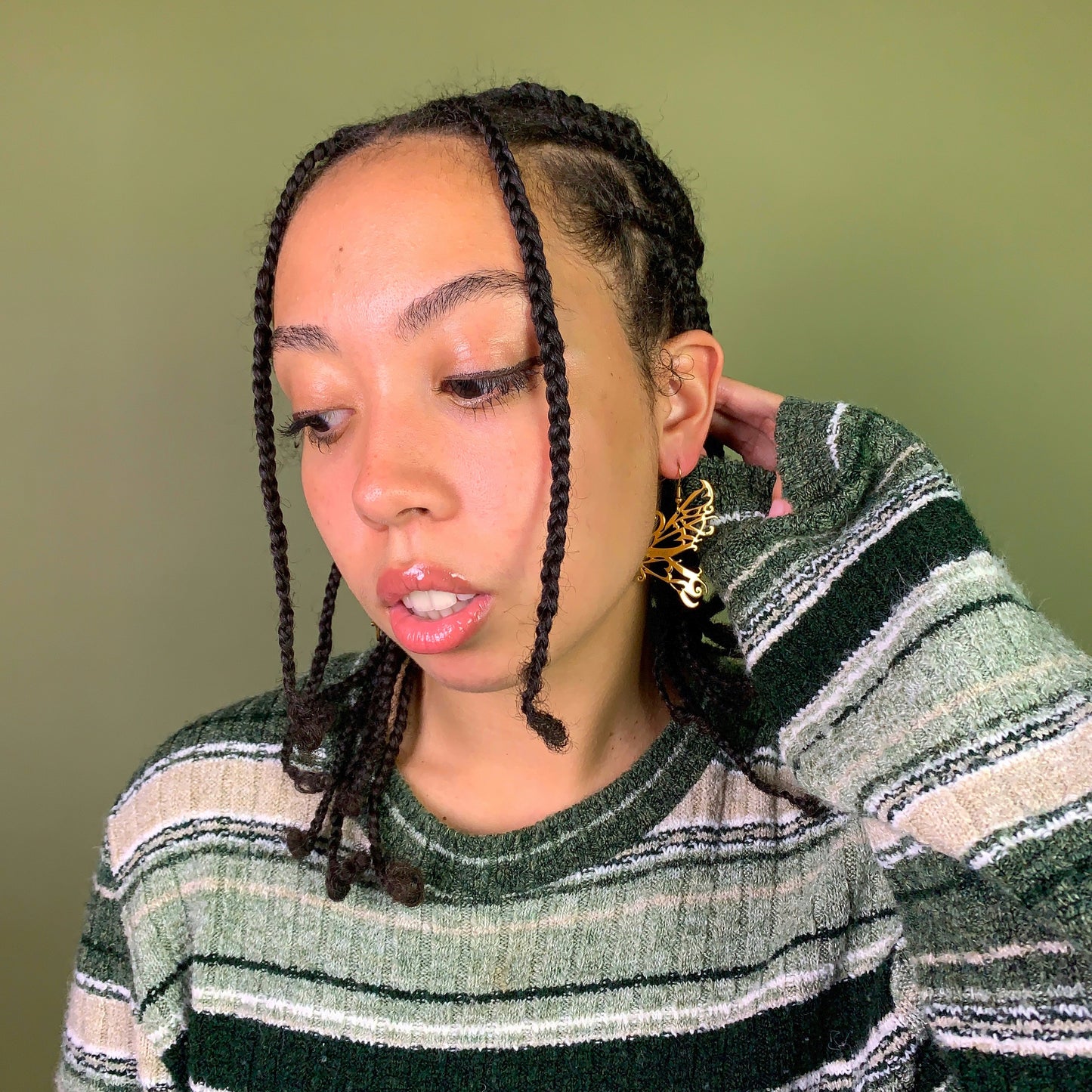 Model with gold fairy earring