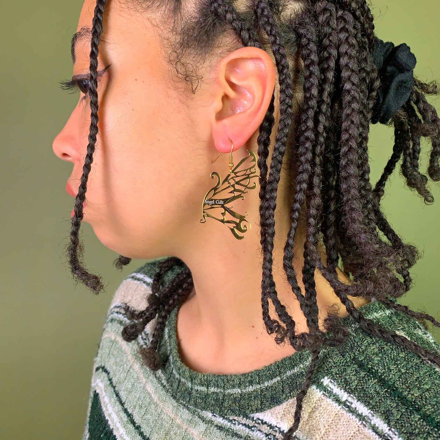 Model with gold fairy earring