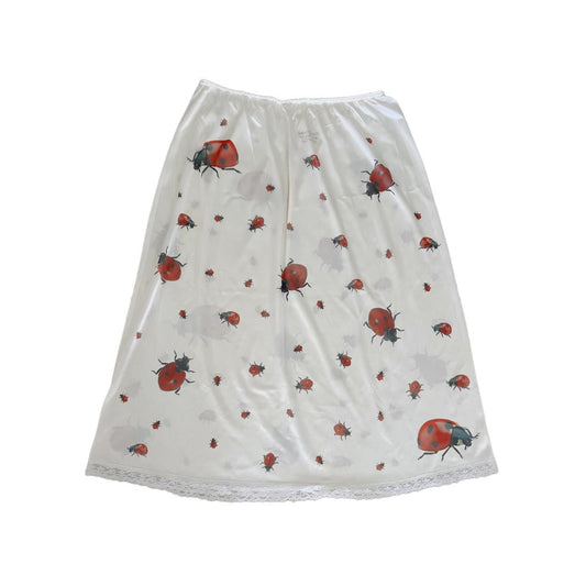 handprinted ladybug all over print on vintage slip skirt